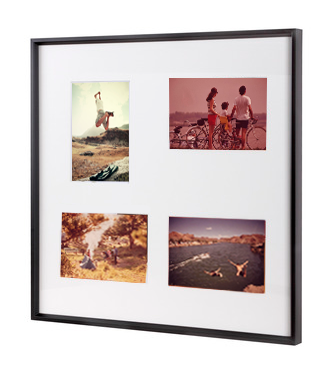 Family photographs framed in a multi aperture photo frame from Nielsen.