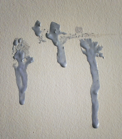 blu tac smeared on a wall, avoid by using ready made picture frames at all times. 
